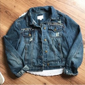 Distressed jean jacket with studs